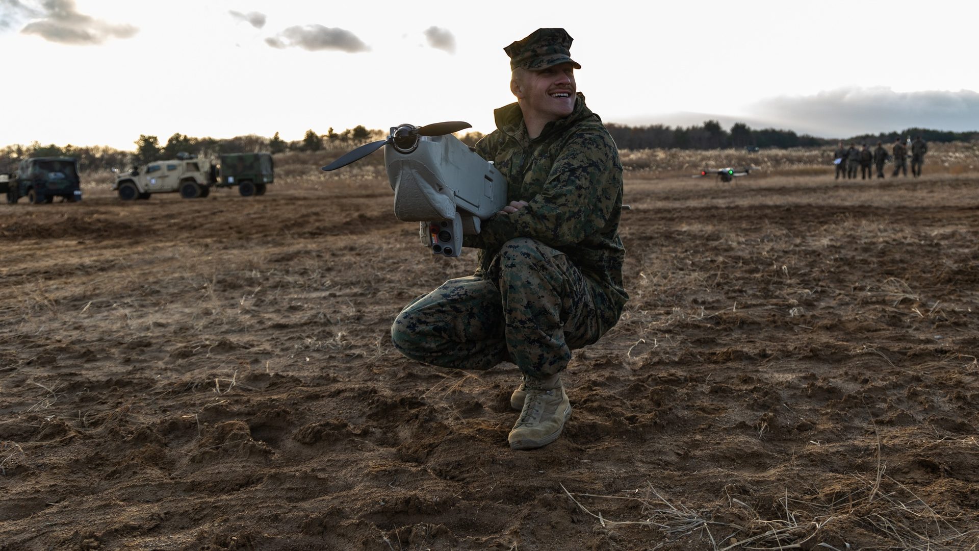 Marine operator with Group 2 fixed-wing UAS in field deployment
